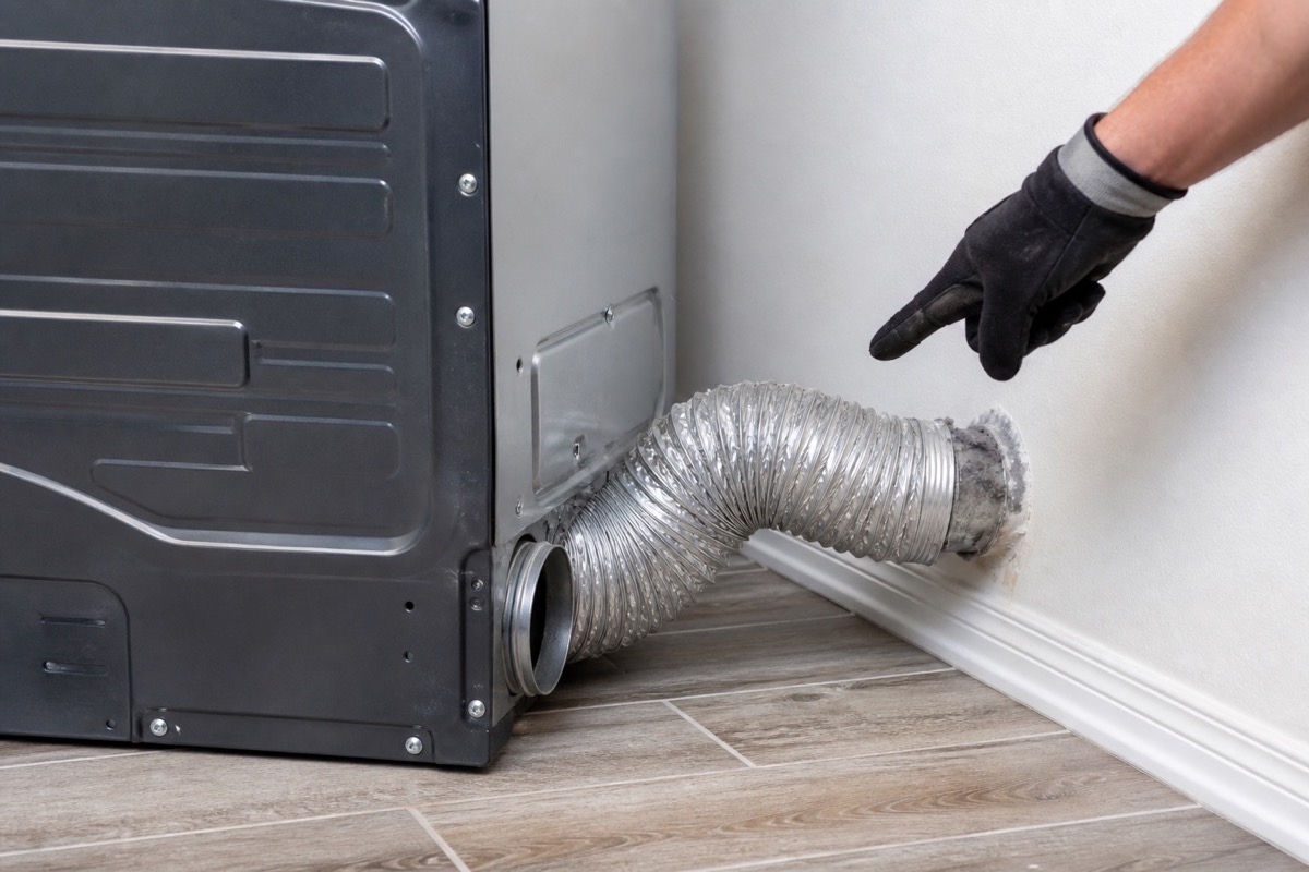 Crushed dryer vent hose behind a dryer causing slow drying