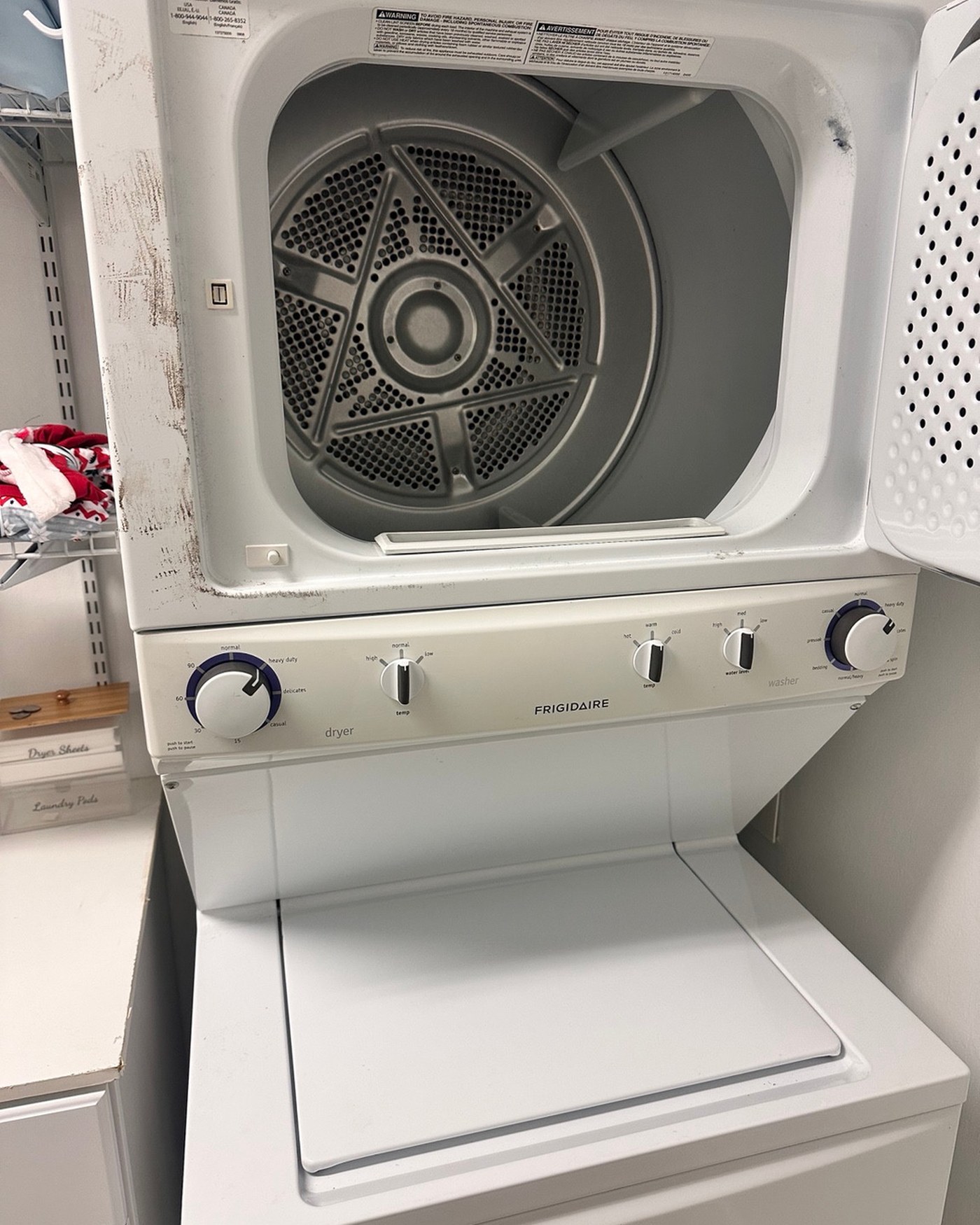 Frigidaire laundry center with its dryer door open.