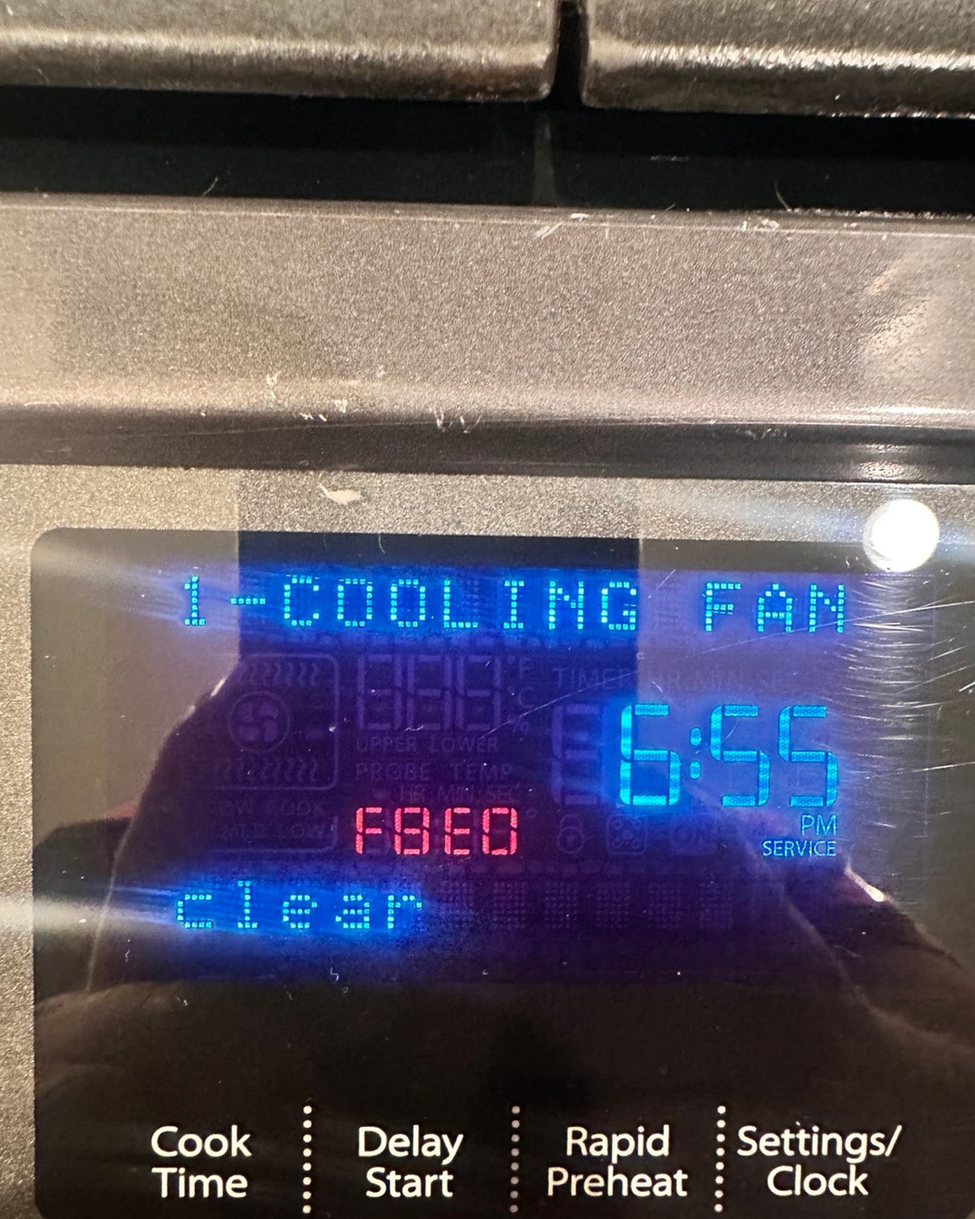 Oven control display showing a cooling fan message.