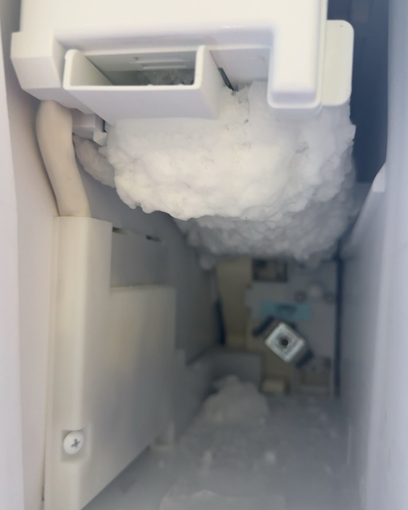 Ice buildup around the ice maker; screenshot controls cropped out.
