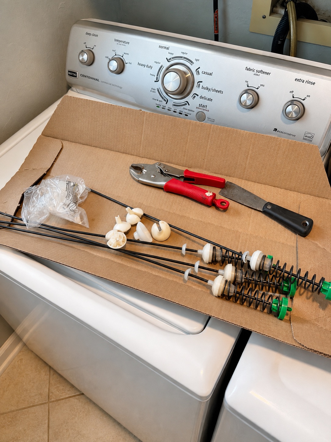 Suspension rods removed from a Maytag MWWC360AW0 washer during repair in Bokeelia Florida