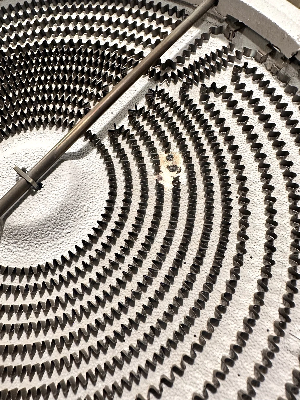 Failed dual radiant surface element removed from an electric range