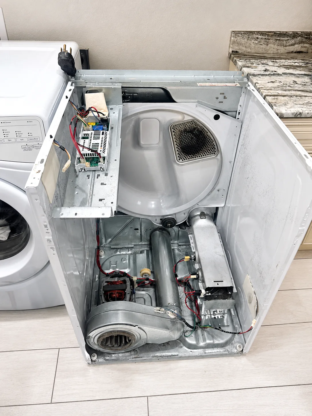 Whirlpool WED75HEFW0 heating element area checked during Cape Coral dryer repair