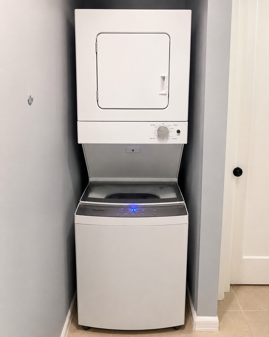 Whirlpool washer and dryer stack serviced during a drain hose replacement in Estero Florida