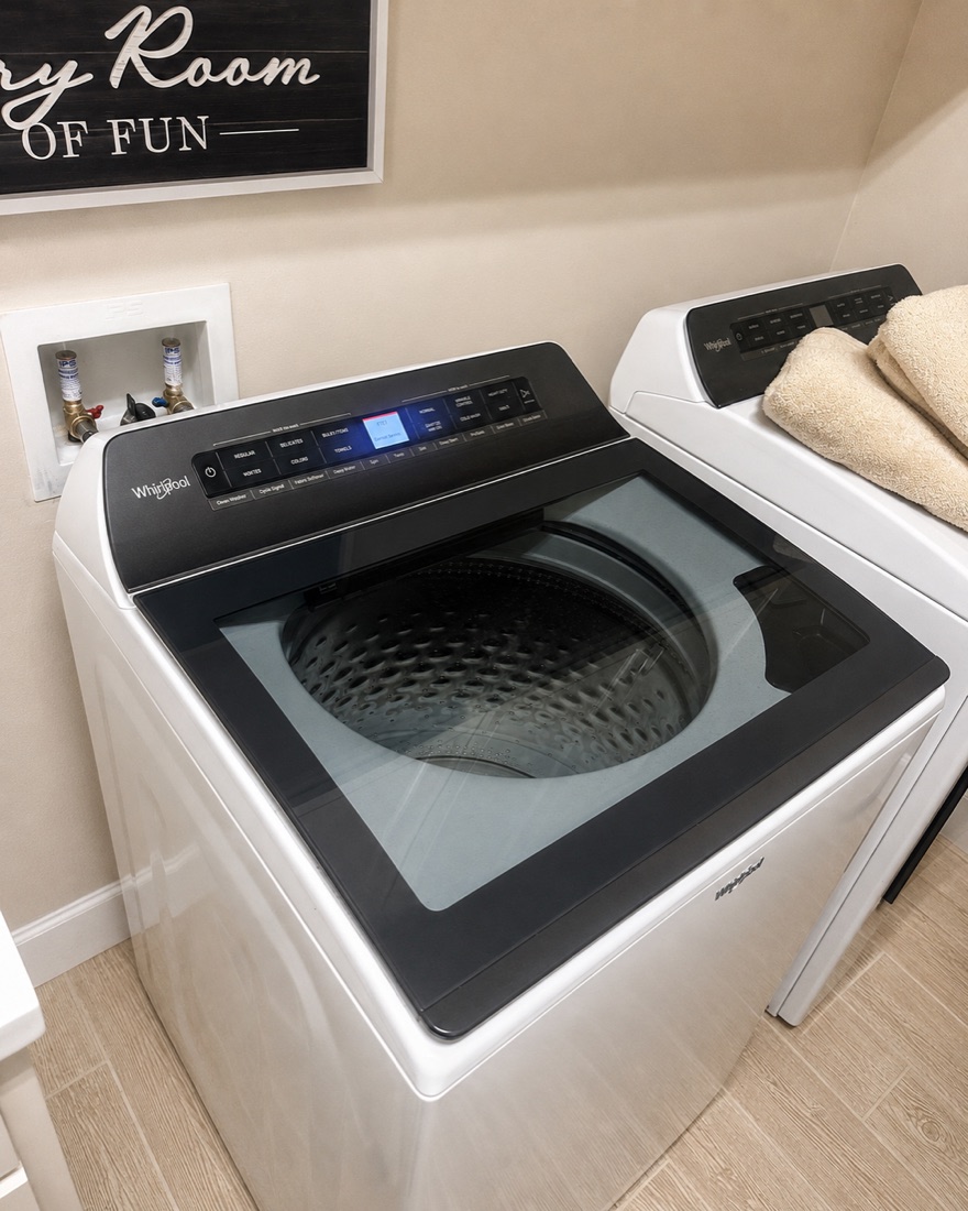 Whirlpool WTW5100HW2 top-load washer during a repair service call in Estero, Florida