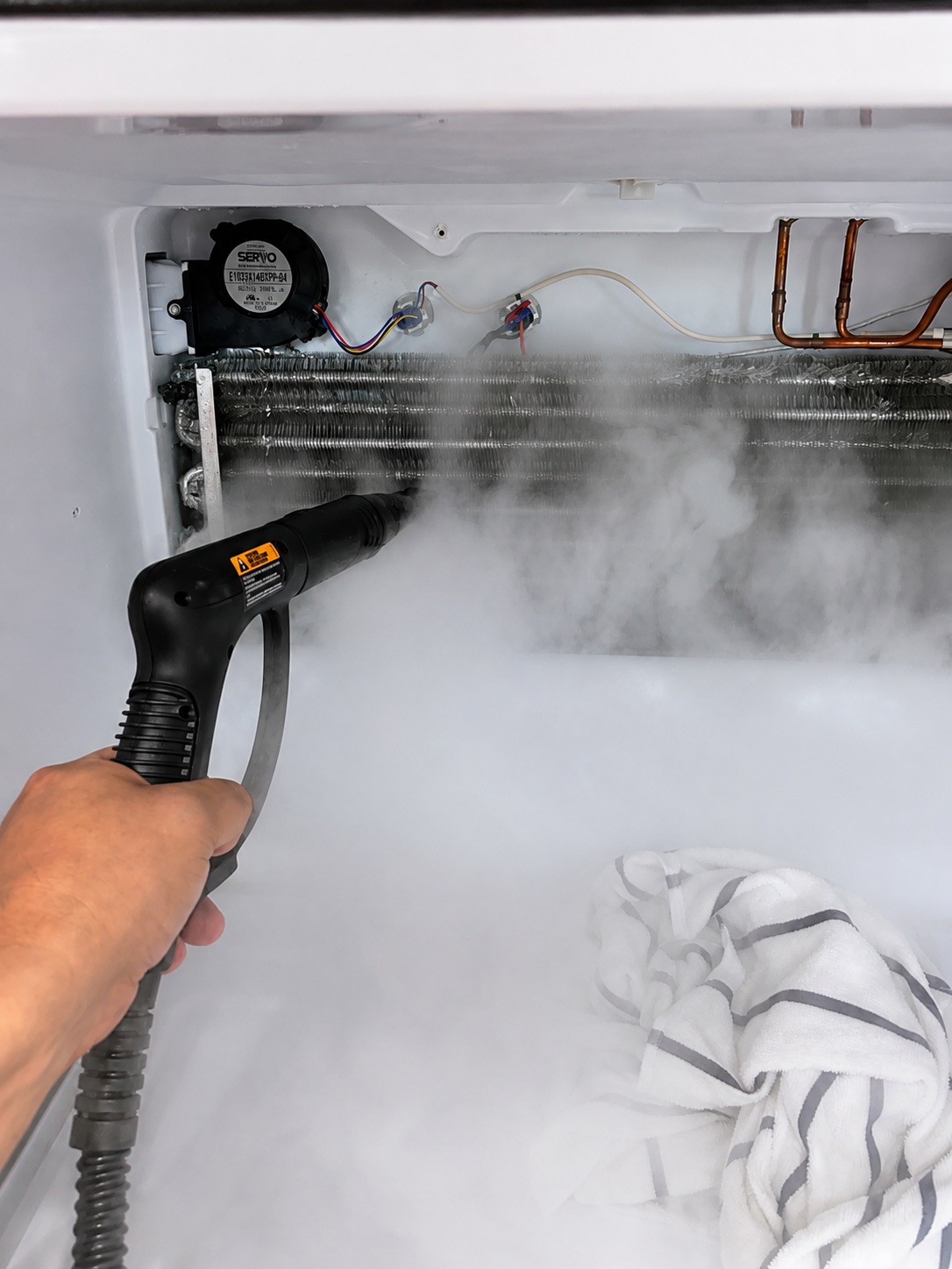 GE refrigerator evaporator during defrost service after frost was removed from the coil