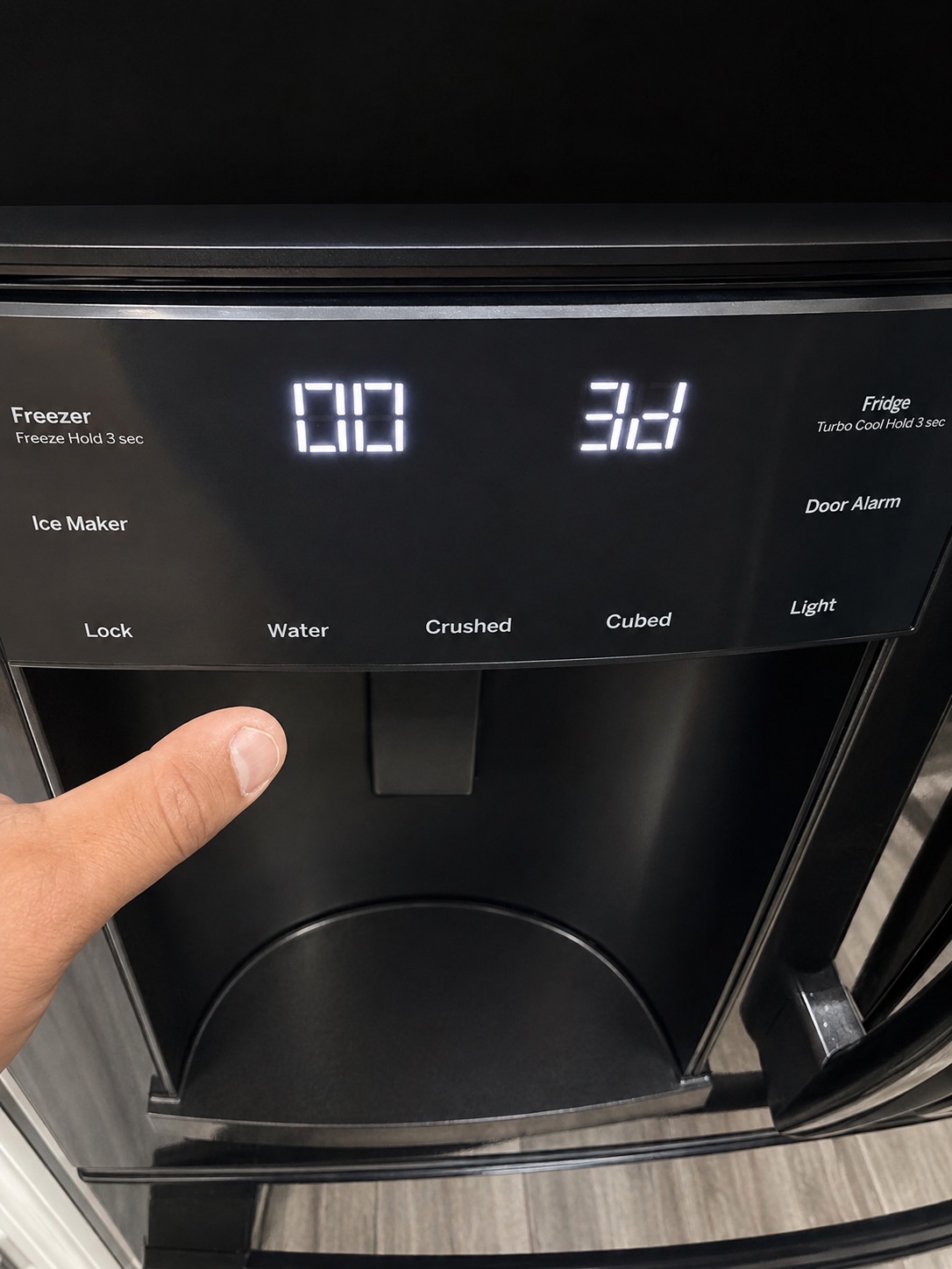Freezer control panel checked after GE refrigerator evaporator defrost repair in Fort Myers
