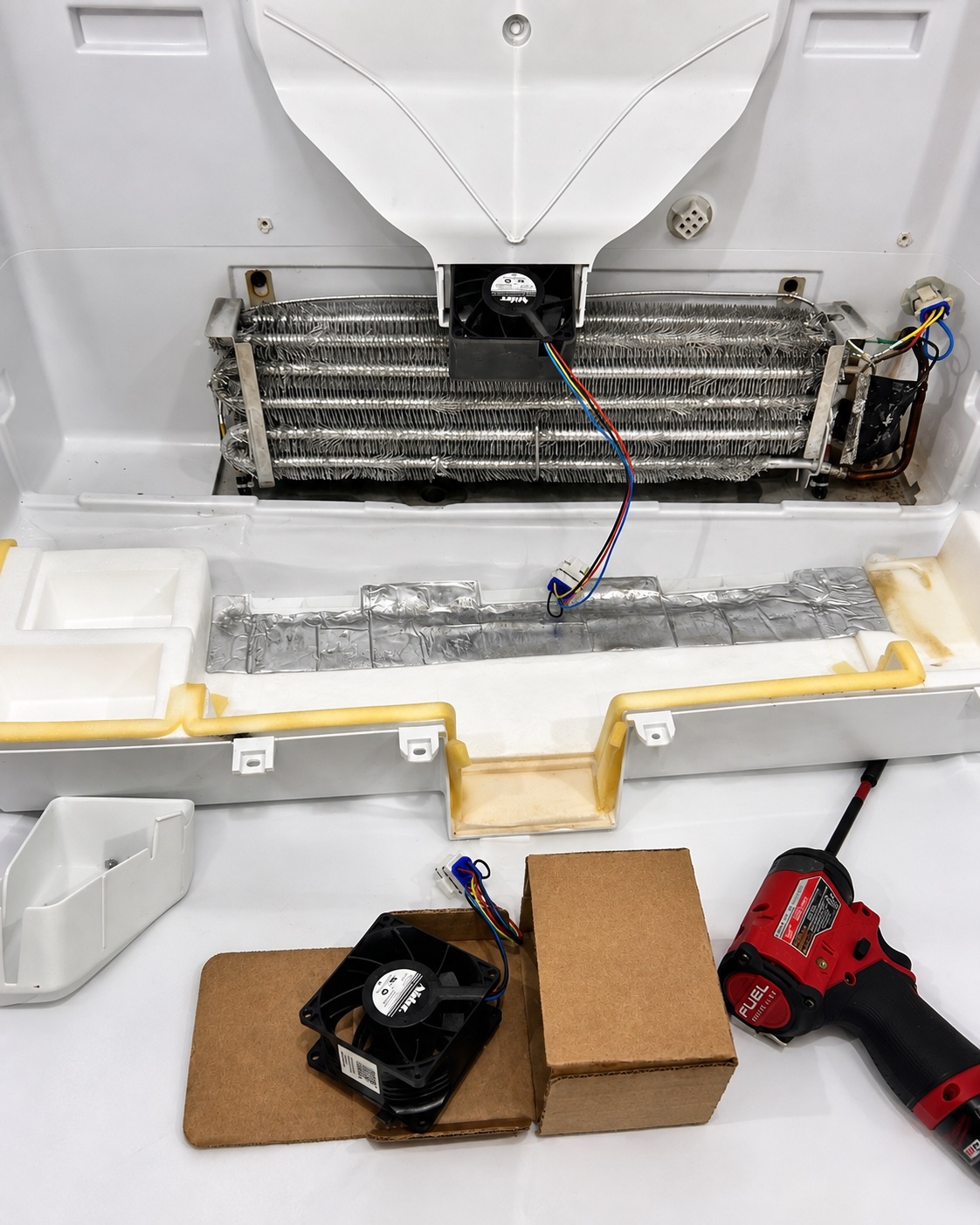 Fresh-food compartment fan replacement during GE GFE26GGKFBB refrigerator repair