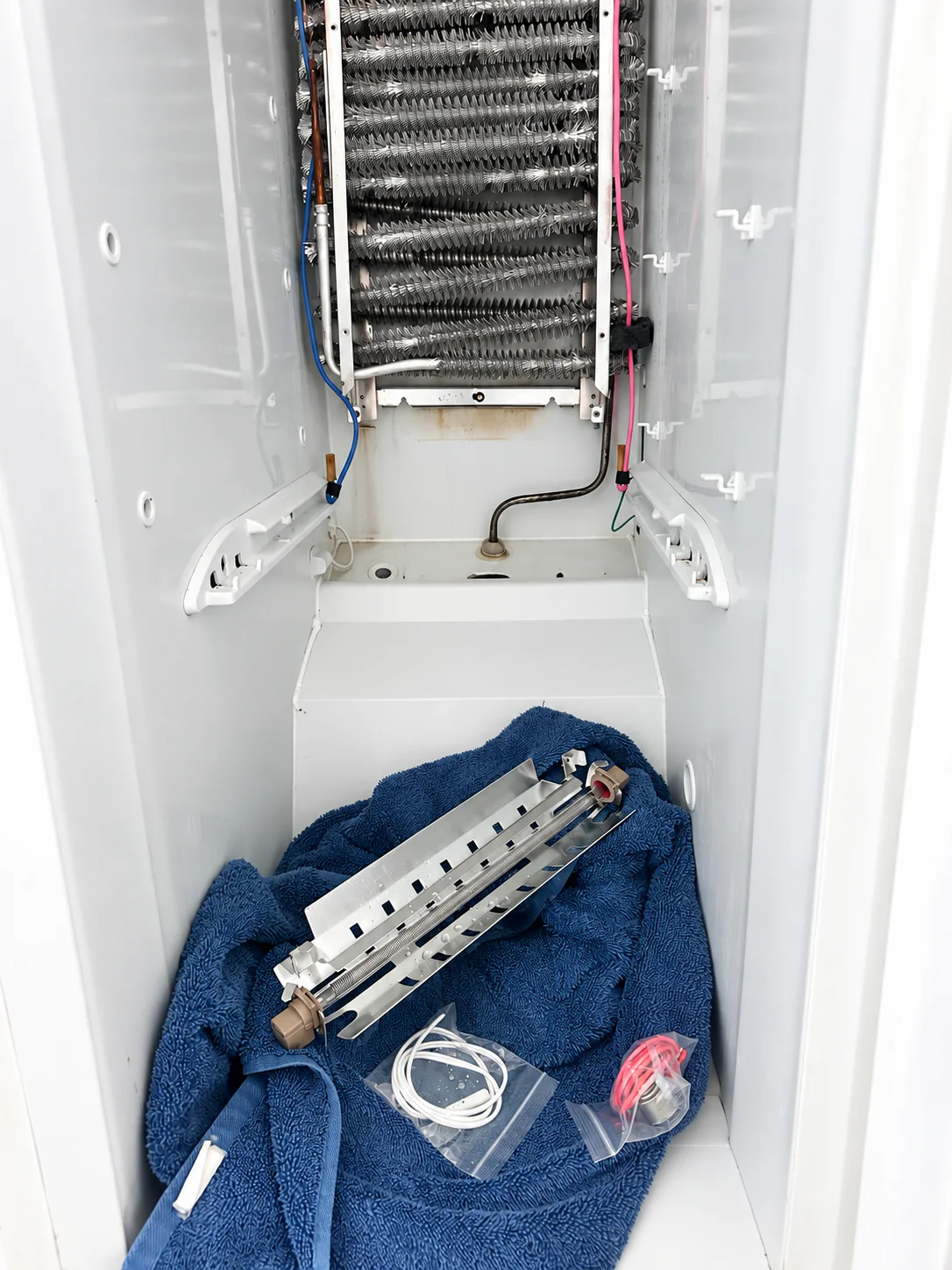 Refrigerator evaporator and defrost repair area during service in Lehigh Acres Florida